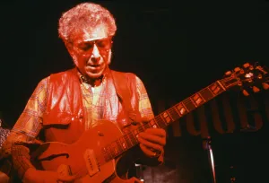 00352 Prints: Pioneering blues musician Alexis Korner performing in London. January 1984