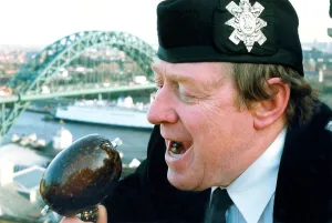 00107 Prints: Piper Derek elliott samples a locally grown haggis in January 1994