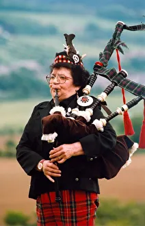 Bagpipes Prints: Piper Sadie Charleton gets in some practice before her next venue in June 1994