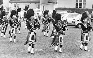 The pipes and drums of the Newcastle City Pipe Band opening a summer fayre in July 1981