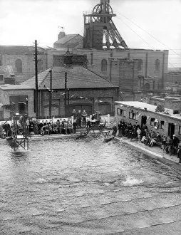 The pit head gear overshadows the converted pit pond swimming pool at Easington colliery
