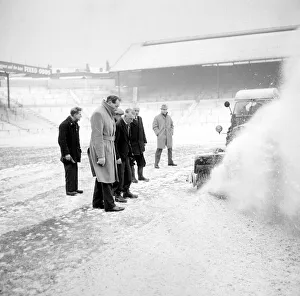Pitch Inspection. Birmingham grounds staff seen here clearing snow from the pitch