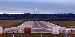 Runway Prints: A plane takes off on a runway over Callerton Hill from Newcastle International Airport