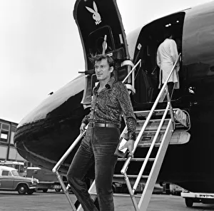 Magazine Prints: Playboy king Hugh Hefner arrives at Heathrow Airport in his Big Bunny