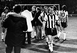 Rocks Prints: Players and officials gather round Mick Mahoney after Newcastle