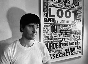 Playwright Joe Orton next to a promotional poster of his new play Loot