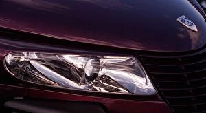 Images Dated 29th October 1998: Plymouth Prowler October 1998 Detail of headlamp bonnet badge logo maroon