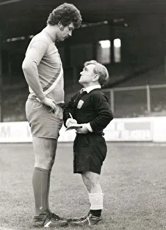 Pocket-sized referee telling off a tall footballer at Reading in Berkshire. February 1980