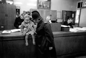 Police and Children. The scene is set in the enquiry office of Bishopsgate Police Station