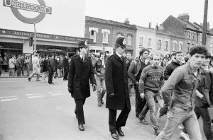 Tube Prints: Police keep an eye on Leeds United supporters at the Arsenal football ground as fans