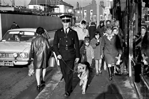 Police man and dog search for a man on the run at Droylsden