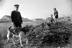 Police man and dog search for a man on the run at Droylsden