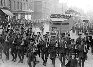 00117 Prints: Police and military march ahead of a convoy of buses through the streets of Liverpool