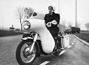 Cambridgeshire Prints: A police motorcycle patrol officer at work in Cambridgeshire. 25th November 1966