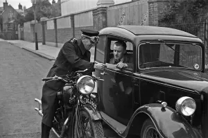 Police Prints: A police motorcyclists issues a warning to a motorist in Hampton, Middlesex
