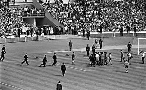 Anger Prints: Police on the pitch as England v Argentina World Cup 1966 game after final