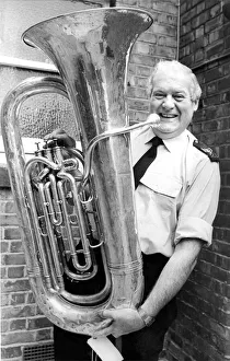 00116 Prints: Police Sergt. Andy Chicken with tubby the tuba which was left behind at Ashington Hirst