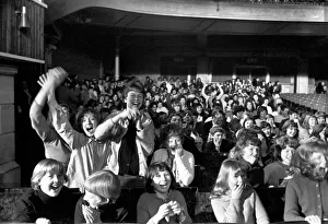 Police try to control fans in the streets of Liverpool before the premiere of the Beatles
