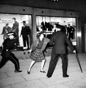 Police try to control fans in the streets of Liverpool before the premiere of the Beatles