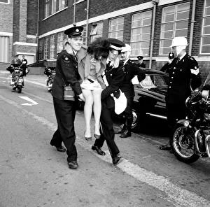 Police try to control fans in the streets of Liverpool before the premiere of The Beatles
