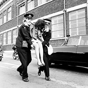 Police try to control fans in the streets of Liverpool before the premiere of The Beatles