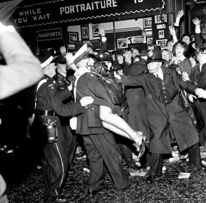 Police try to control fans in the streets of Liverpool before the premiere of The Beatles
