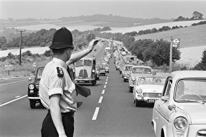 Policeman directing August Bank Holiday taffic on the A20