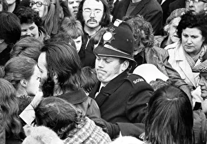 Pushing Prints: A policeman struggles with the crowd after Liberal party supporters tried to push through
