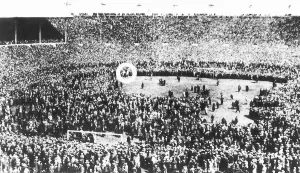 A policeman on a white horse tries to control crowds which came on to the pitch before