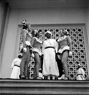 Politician Berber Pasha (Thamilel Galoui) meets women dancers on the steps of