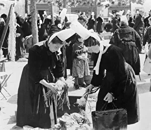 National Dress Prints: Pont l Abbe Brittany France Local women shopping look at vegetables in