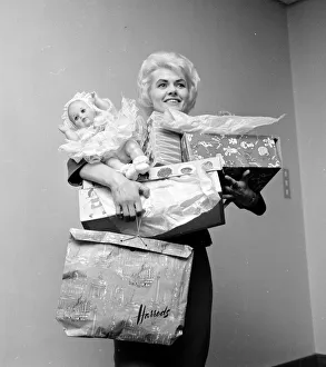 Gifts Prints: Pools winner Vivienne Nicholson all smiles stacked up with gifts after a shopping spree