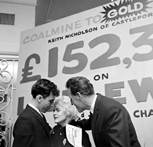 Pools winner Vivienne Nicholson and husband Keith Howard Nicholson receive a cheque for