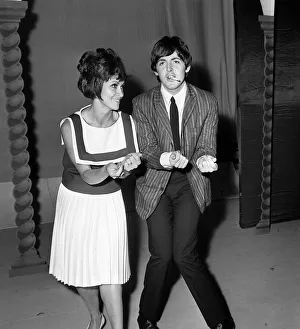 Pop Group The Beatles July 1964. Paul McCartney with singer Chita River during
