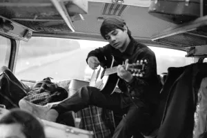 00082 Prints: Pop group The Fourmost on tour Bertie Higgins of the Roemans group practices guitar