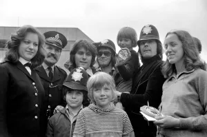 Pop Group Mud'. with young children holding various awards May 1975