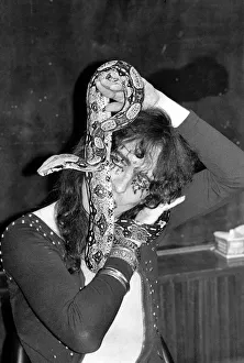 00274 Prints: Pop singer Alice Cooper aged 23 flew into Heathrow Airport today with his pet boa
