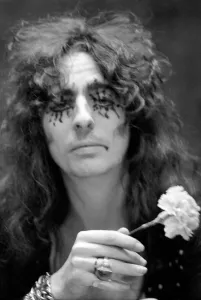 00274 Prints: Pop singer Alice Cooper aged 23 flew into Heathrow Airport today with his pet boa