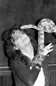 00274 Prints: Pop singer Alice Cooper aged 23 flew into Heathrow Airport today with his pet boa