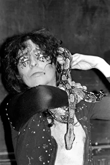 00274 Prints: Pop singer Alice Cooper aged 23 flew into Heathrow Airport today with his pet boa