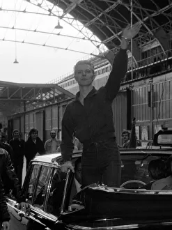 Stations Prints: Pop singer David Bowie waves to fans as he arrives at Victoria Station May 1976