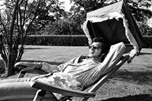 Pop singer Englebert Humperdinck relaxing in the garden of his county house near Great