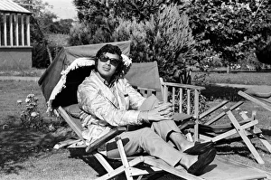 01366 Prints: Pop singer Englebert Humperdinck relaxing in the garden of his county house near Great