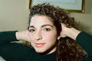Pop singer Gloria Estefan poses in her hotel room on a visit to London. 31st October 1988