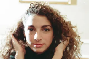 Pop singer Gloria Estefan poses in her hotel room on a visit to London