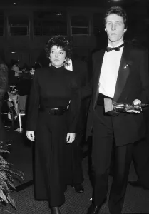 00190 Prints: Pop singer Kate Bush arrives at an award ceremony in London with A mystery man