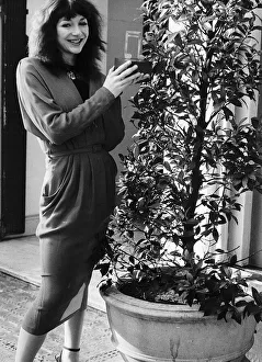 Pop singer Kate Bush with her Melody Maker Pop Award for Top Female Singer