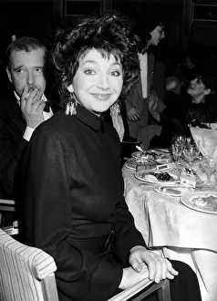 Pop singer Kate Bush sitting at a dinner table February 1987