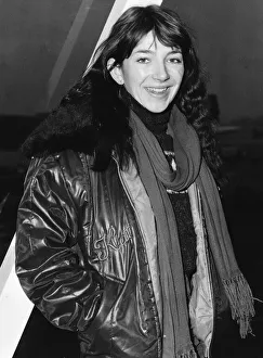00188 Prints: Pop singer Kate Busharriving at London Airport wearing a leather jacket with fur collar