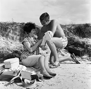 Pop singer Marty Wilde and his 19-year-old wife Joyce on the beach at Shell Bay, Dorset